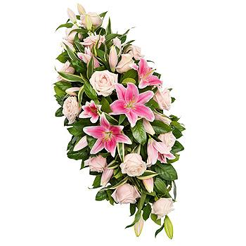 Floral arrangement with pink lilies and white roses on a white background