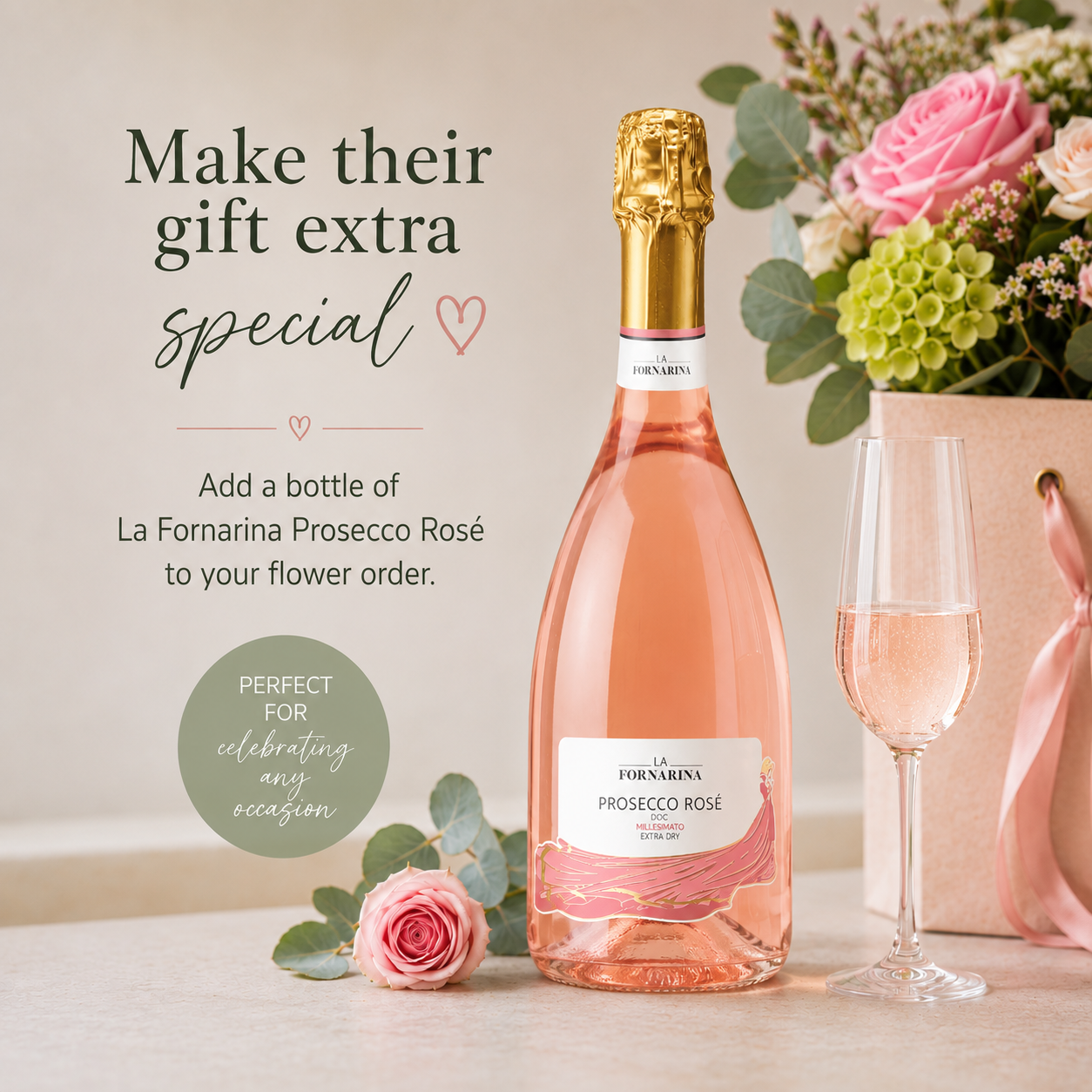 Bottle of rose Prosecco with roses and a glass 