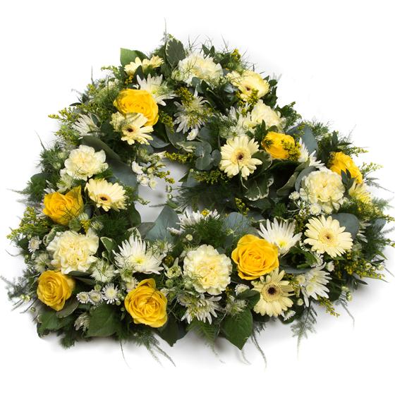 Floral wreath with yellow and white flowers on a white background