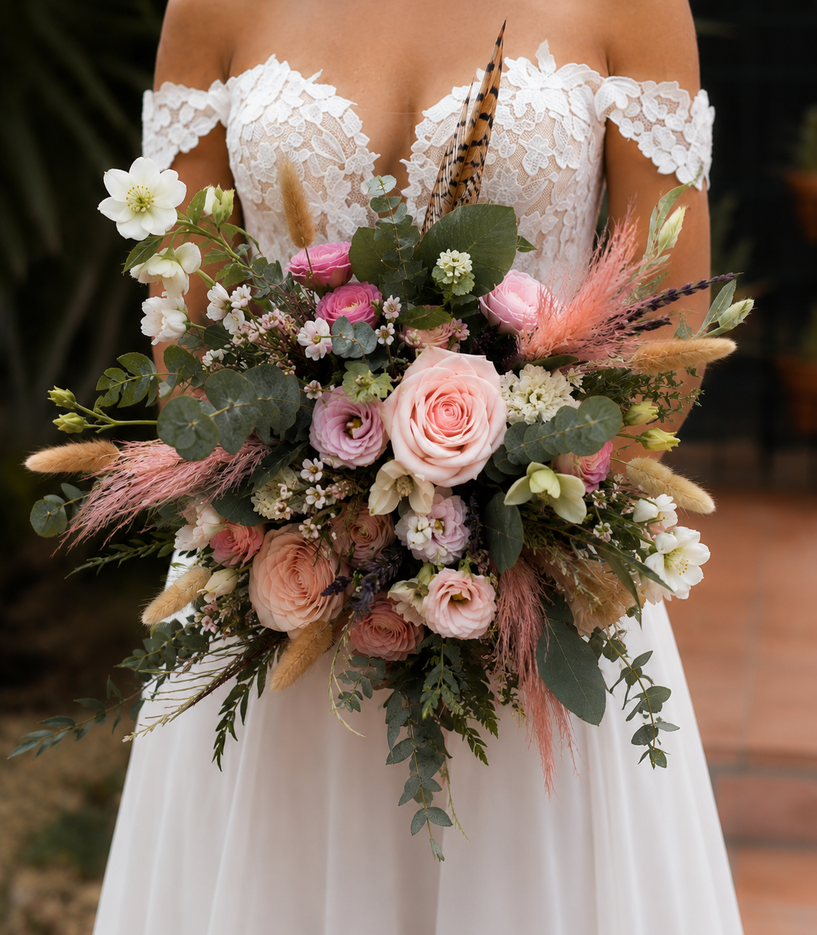 Bouquet of flowers held by a person wearing a lace dress.