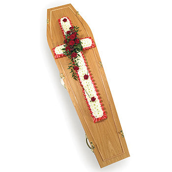 Wooden coffin with floral decoration on a white background