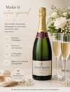 a bottle of quality champagne with flowers and two glasses