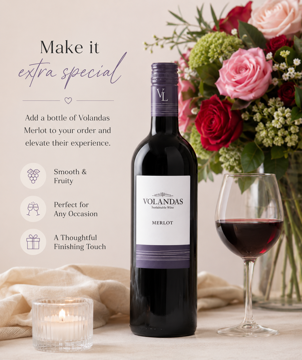 Bottle of Volandas Merlot wine with a glass of wine and flowers on a table.
